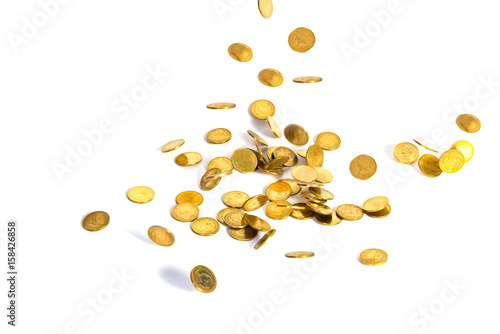 Falling gold coins. Money on a white background. shallow focus.