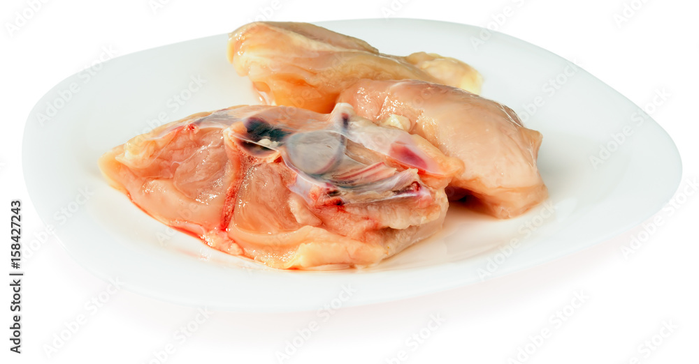Fresh filleted chicken on plate Fresh filleted chicken on plate