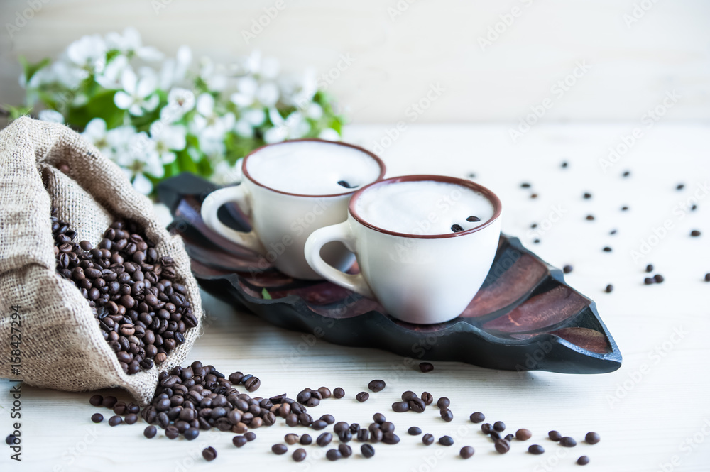 Two cups of freshly brewed, frothy cappuccino. Spilled coffee grains, chocolate and cane sugar. Theme of coffee, cappuccino, mocha chino, america no. Beautiful elegant background with place for text
Two cups of freshly brewed, frothy cappuccino. Spilled coffee grains, chocolate and cane sugar. Theme of coffee, cappuccino, mocha chino, america no. Beautiful elegant background with place for text