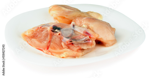 Fresh filleted chicken on plate