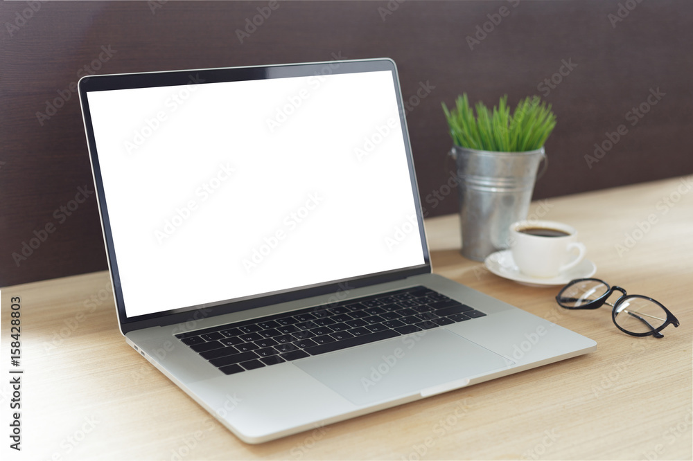 laptop computer on work desk showing white screen side view laptop computer on work desk showing white screen side view