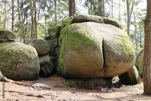 Rock structure Ďáblova prdel Devil´s ass in forest near Horni Meziricko, Czech republic
