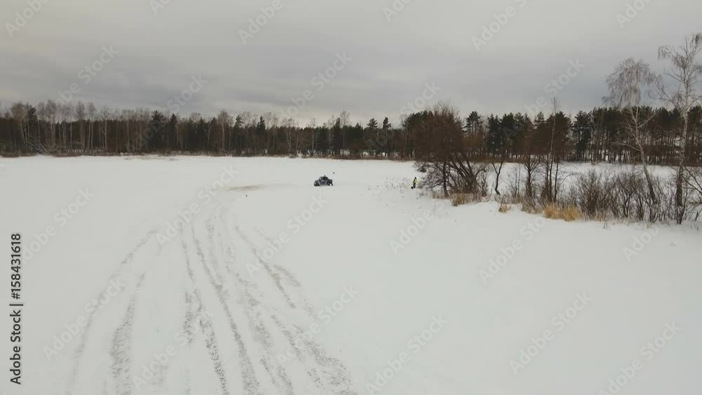 Winter off-road racing side-by-side vehicles. Aerial view: Rally on the buggy on the snow on a winter day. Racing in the SXS class. Buggy, sports car on rally. Off Road Series racing. 4K video, drone Winter off-road racing side-by-side vehicles. Aerial view: Rally on the buggy on the snow on a winter day. Racing in the SXS class. Buggy, sports car on rally. Off Road Series racing. 4K video, drone