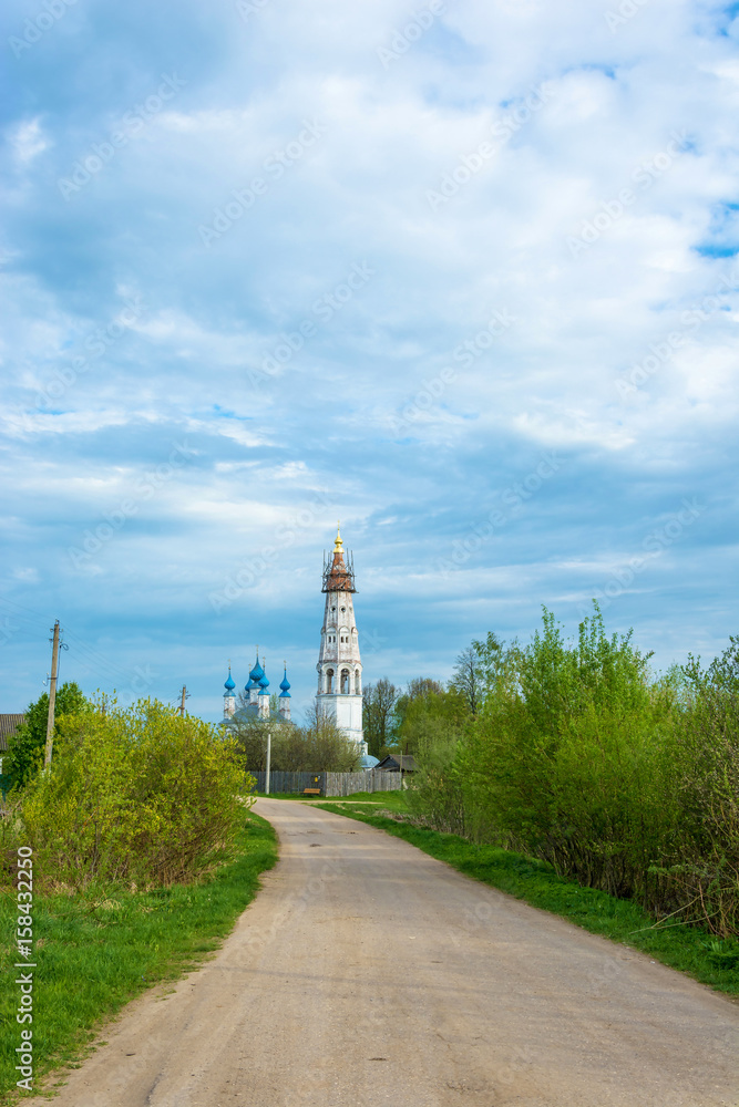 Dirt road to the Church of the Holy Archangel Michael and the bodiless hosts in the village of Mikhailovskoye, Ivanovo oblast , Russia.