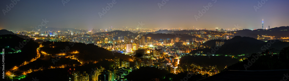 panorama of Taipei, Taiwan city skyline at twilight.