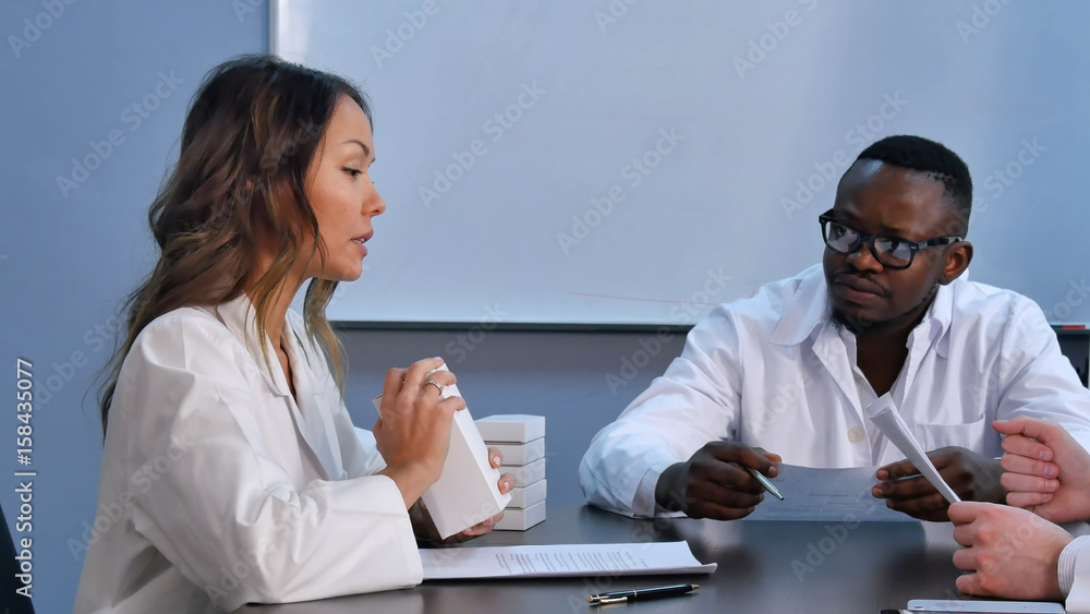 Medical doctors are discussing diagnosis and searching medicine for patients Medical doctors are discussing diagnosis and searching medicine for patients