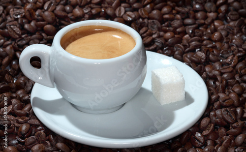 cup of coffee on the background of coffee beans