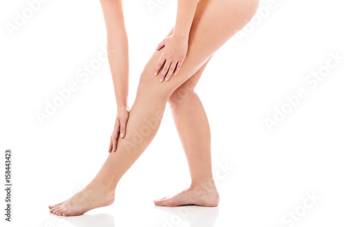 Woman touching her long legs
