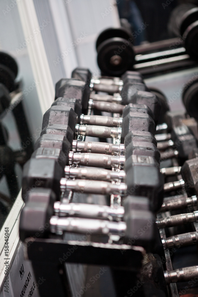 Fitness equipment in a gym. Workout and barbell Fitness equipment in a gym. Workout and barbell