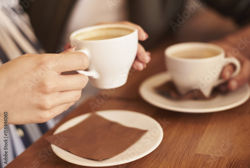 People in cafe having coffee break