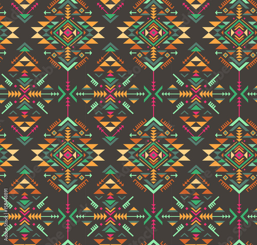 Colorful ethnic seamless pattern with geometric shapes.