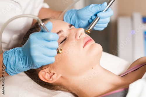 Conceptual beauty and cosmetology image of the hands of several beauticians holding their respective equipment. Beauty concept. Cosmetology concept. Cosmetology salon. Cosmetic procedures mesotherapy