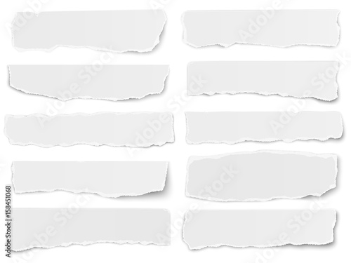 Set of elongated torn paper fragments isolated on white background photo