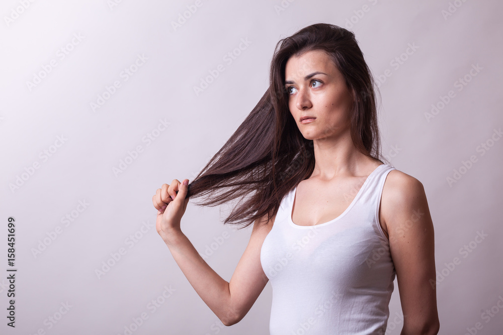 Gorgeous woman posing in studio on gray background. Sexy lady. Perfect beautiful attractive female posing in model test in studio Gorgeous woman posing in studio on gray background. Sexy lady. Perfect beautiful attractive female posing in model test in studio