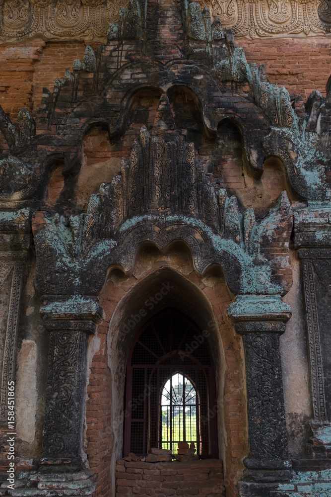 Ancient bas-relief with mythical creature on the facade of Pagoda, Bagan Myanmar