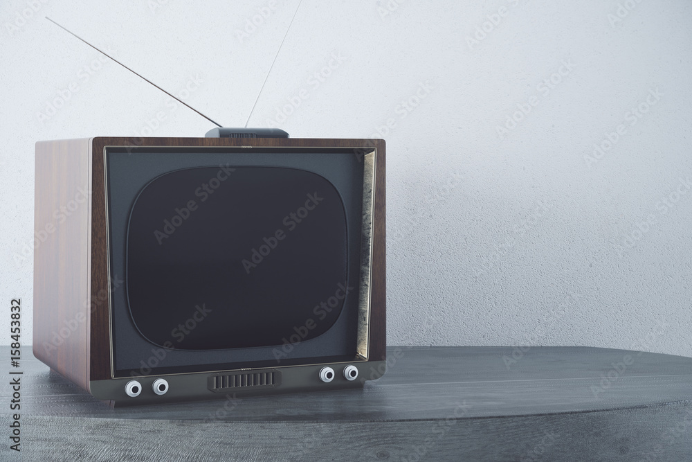 Vintage TV on concrete background