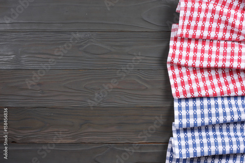 blue and red cloth on dark wooden background with copy space. Top view.