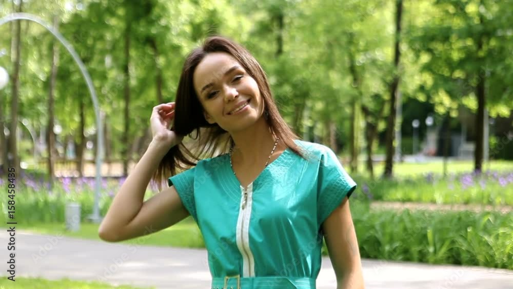 Outdoor portrait of happy beautiful brunette caucasian woman with amazing smile, smiling, laughing and looking at camera. HD Outdoor portrait of happy beautiful brunette caucasian woman with amazing smile, smiling, laughing and looking at camera. HD