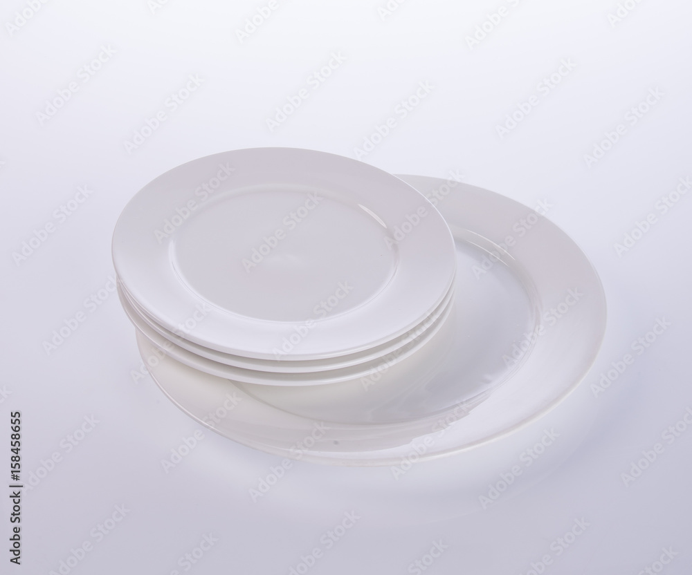 plate or ceramic tableware on the background. plate or ceramic tableware on the background.