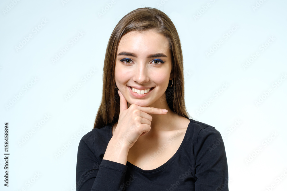 Portrait of a beautiful young woman looking at the camera and smiling Portrait of a beautiful young woman looking at the camera and smiling