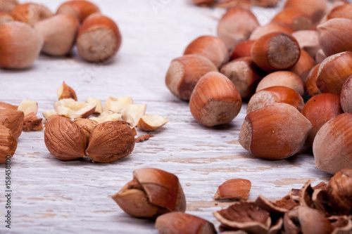 Healthy Hazelnuts on white wooden background in studio photo. Healhty snacks