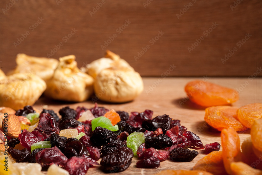 Mix of dried fruits on wooden background in studio photo. Healthy lifestyle Mix of dried fruits on wooden background in studio photo. Healthy lifestyle