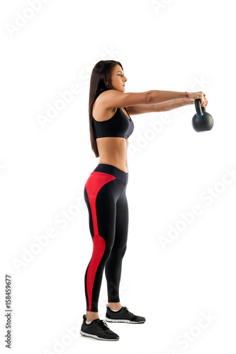 Stages of exercise with weight. Young sports woman fitness model doing an exercise with a weight, hands in front of a white background isolated