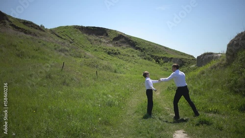 Father and son play boxing in nature, male education, play