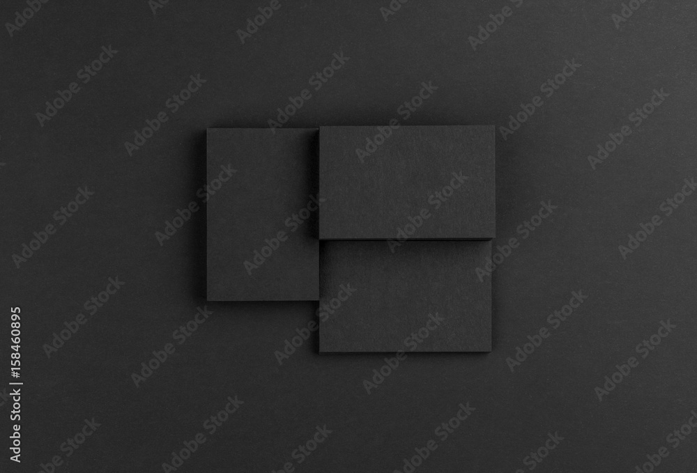 Black business cards isolated on black background Black business cards isolated on black background
