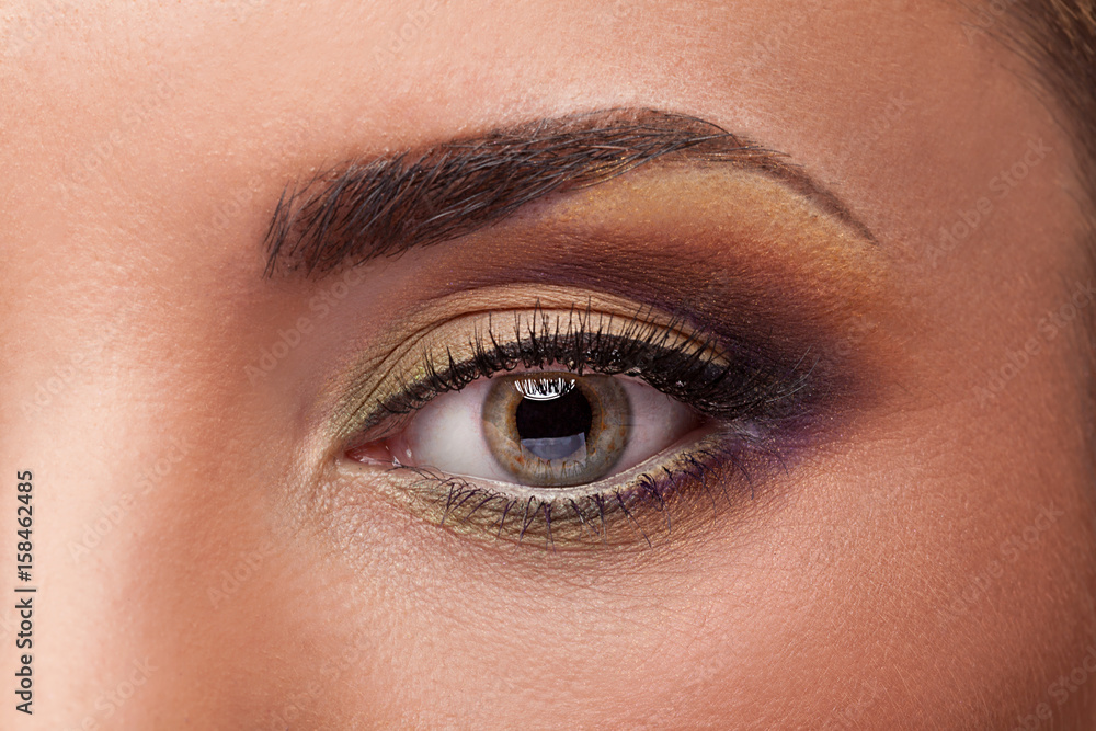 Close up photo of an eye with perfect make up. Professional beauty image Close up photo of an eye with perfect make up. Professional beauty image