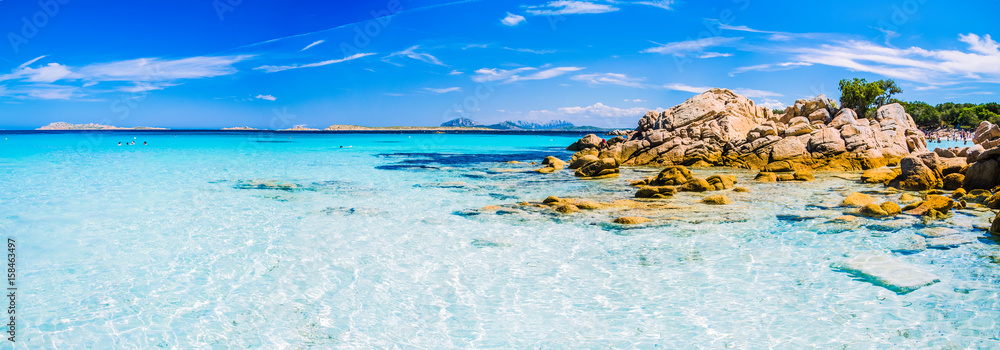 Clear amazing azure coloured sea water with gtanote rocks in Capriccioli beach, Sardinia, Italy - obrazy, fototapety, plakaty 