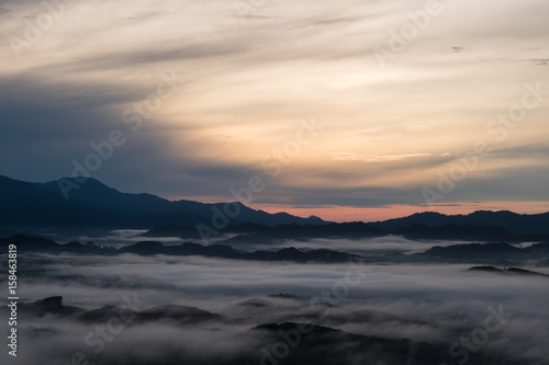 scenery view. sunrise on top of hill in morning time. have cloud and green mountain are background. this image for nature and landscape concept