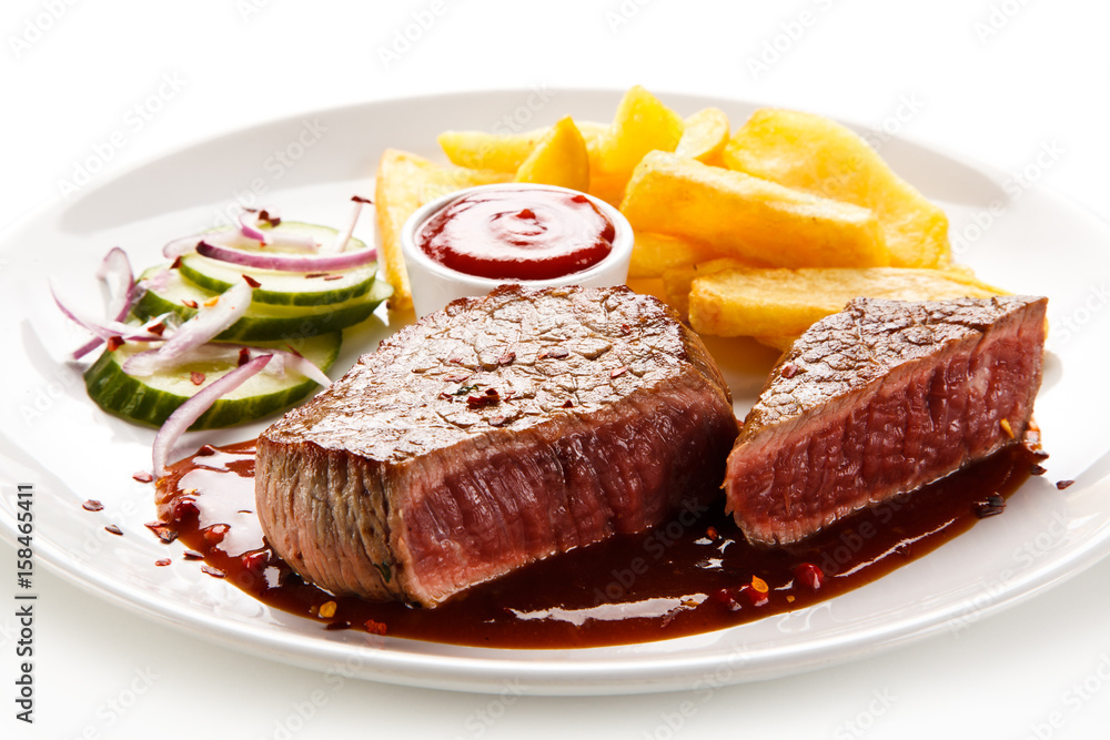 Grilled beefsteak with french fries on white background