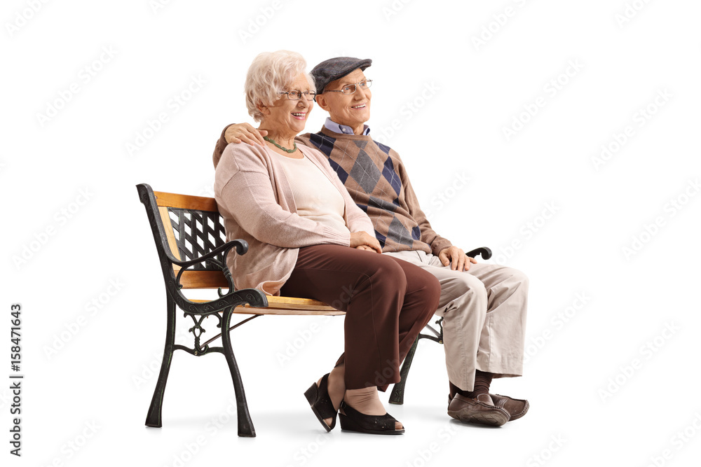 Obraz premium Senior couple sitting on a bench and looking away