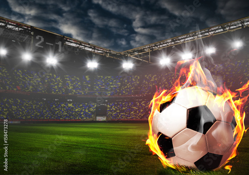 Soccer or football ball on fire at stadium © Sergey Peterman