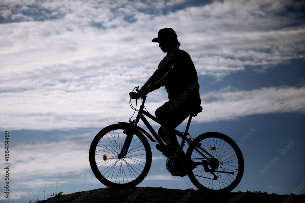 Silhouette of Mountain bike.Sport and healthy life.Extreme sports.Mountain bicycle and man.Life style outdoor extreme sport Silhouette of Mountain bike.Sport and healthy life.Extreme sports.Mountain bicycle and man.Life style outdoor extreme sport
