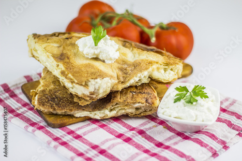 Cheese burek composition on white background
