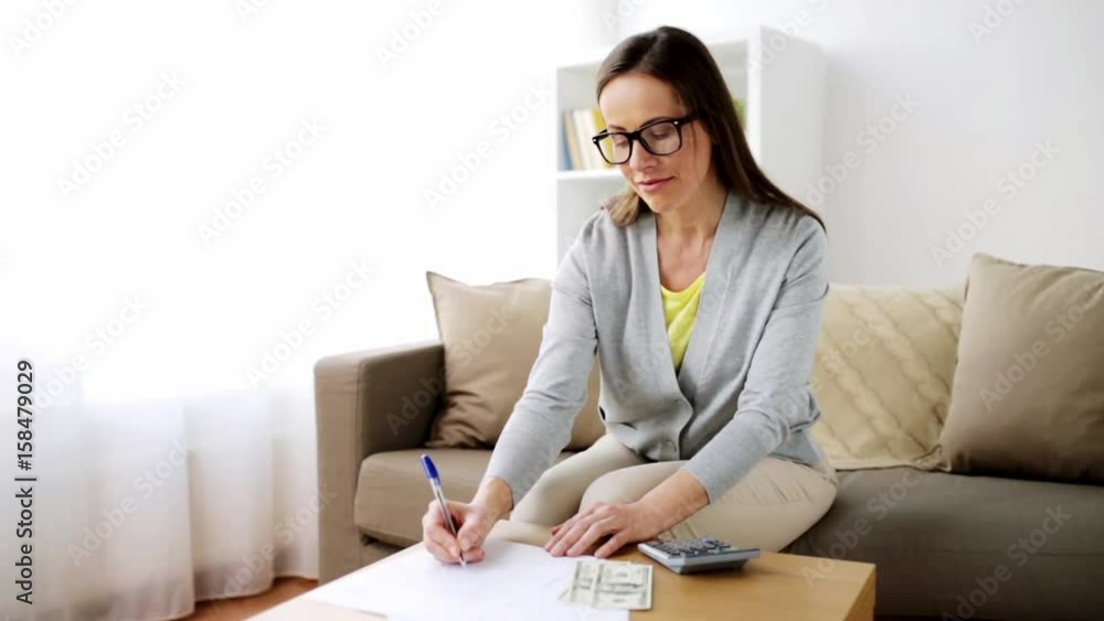 woman with money, papers and calculator at home woman with money, papers and calculator at home