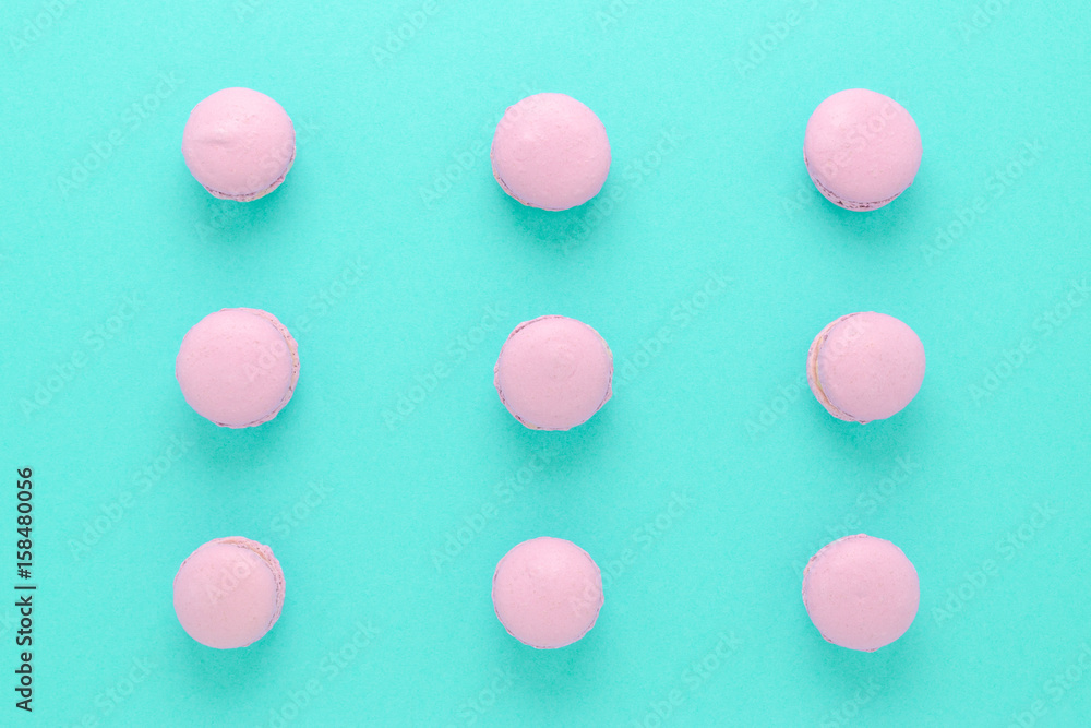 pink macaroons homemade on turquoise background top view pink macaroons homemade on turquoise background top view