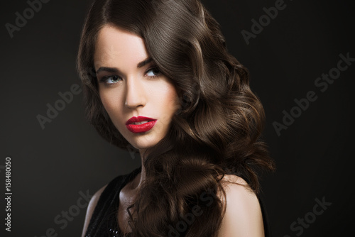 Beautiful woman, glamour portrait on dark background  © Tijana