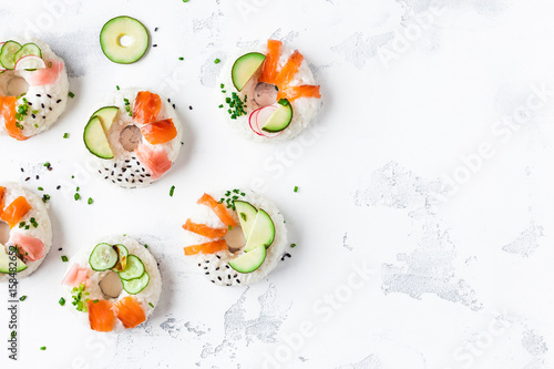 Sushi donuts set on white background. Sushi trend. Creative food. Flat lay, top view