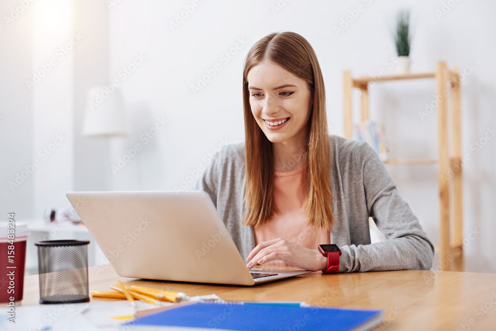 Productive cheerful girl focused on her task Productive cheerful girl focused on her task