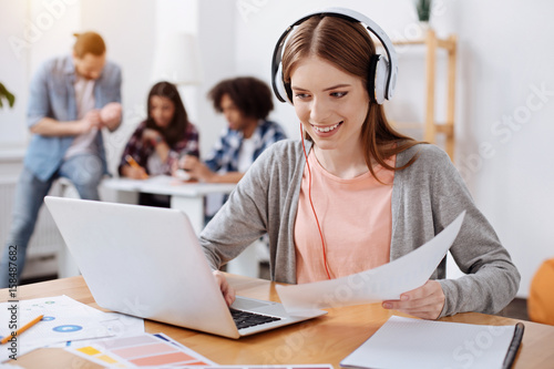 Bright inspiring woman watching educative videos