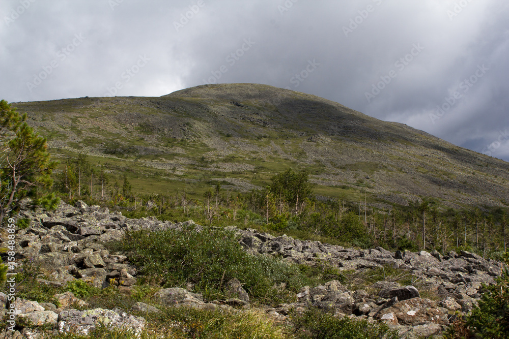 Panoramic view of the mountains and cliffs, South Ural. Summer in the mountains. Panoramic view of the mountains and cliffs, South Ural. Summer in the mountains.