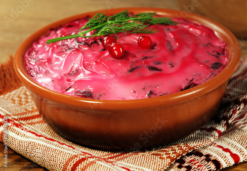 Russian traditional beetroot salad with fish herring photo