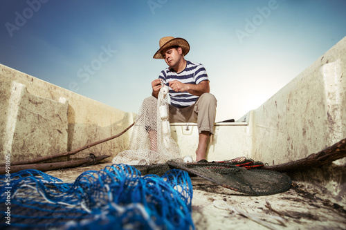 Fisherman throwing the net