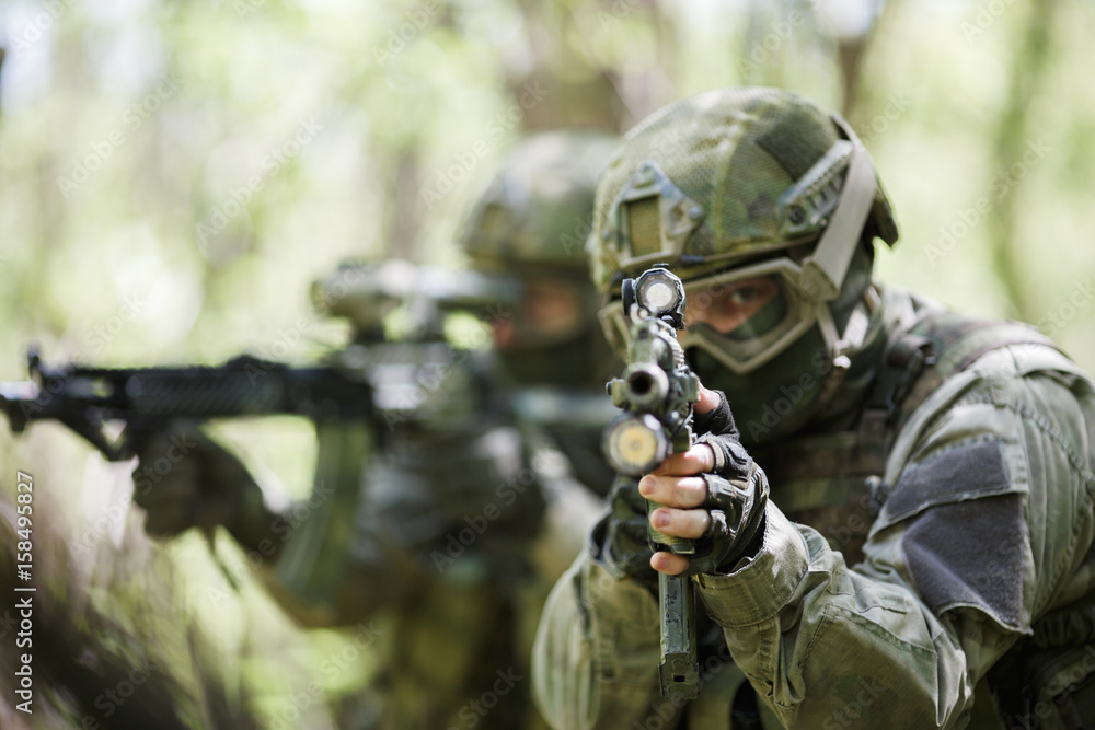 Fototapeta premium Portrait of officers with weapons