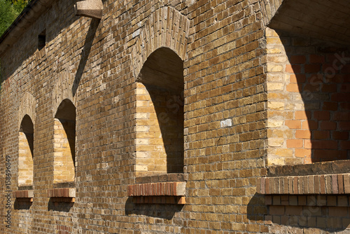 Embrasures for artillery in the brick wall of the caponier. Fragment of the fortification of the nineteenth century The Kiev Fortress