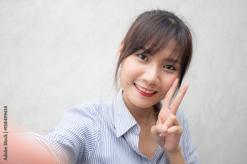 Beautiful young asian woman using smartphone for selfie, 20s year old. Beautiful young asian woman using smartphone for selfie, 20s year old.
