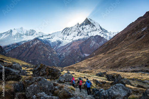 The traveler's walking on the way to Annapurna base camp photo